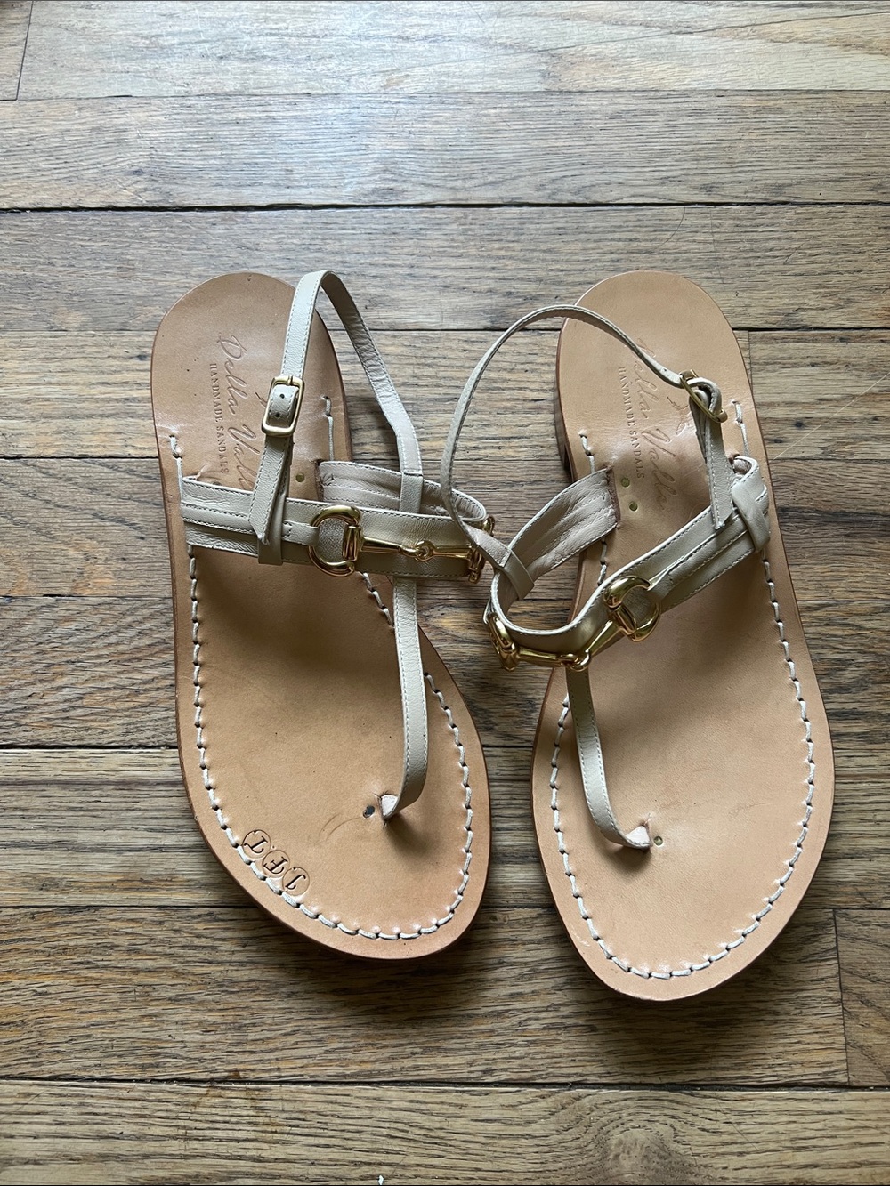 Della Valle Women’s Cream Leather T-Strap Sandals with Gold Accents